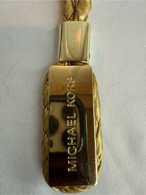MICHAEL KORS GOLD TONE AND METALLIC BRAIDED CORDED BAG CHARM